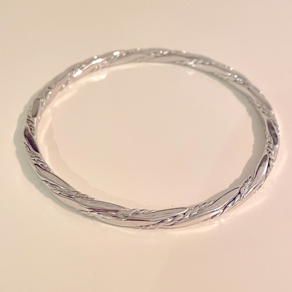 Vintage MONET twisted rope silver tone bangle bracelet.